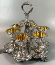 Good quality silver plated egg cruet set with gilt interior on Rococo style stand. (B.P. 21% + VAT)