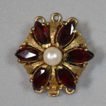 9ct gold garnet and pearl pendant of flowerhead form. 6g approx. (B.P. 21% + VAT)