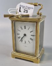 Brass carriage clock, indistinctly marked to the front 'Paris', with key. (B.P. 21% + VAT)