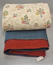 Two vintage quilts; one reversible woollen Welsh quilt with spiral sewn in designs and a floral