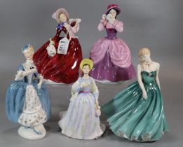 Five Royal Doulton bone china figurines to include: 'Autumn Breezes', Pretty ladies 'Clare', '