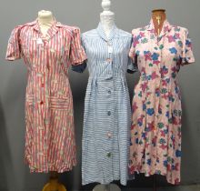 Three vintage 1940's/50's shirtwaister dresses; a cotton striped, a linen striped dress and a floral