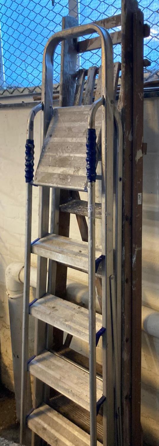 Two folding step ladders; one 'Abru' aluminium and one wooden. (2) (B.P. 21% + VAT)