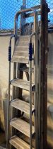 Two folding step ladders; one 'Abru' aluminium and one wooden. (2) (B.P. 21% + VAT)