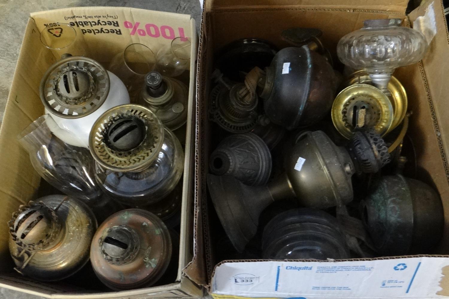 Two boxes of oil burners and oil burner parts; glass reservoirs, metal reservoirs and bases, clear