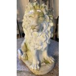 Composition stone garden figure of a seated male lion. 59cm high approx. (B.P. 21% + VAT)