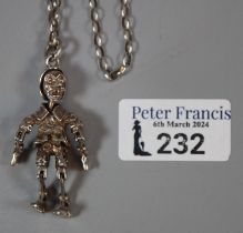 Silver hallmarked articulated Pinocchio and silver chain. (B.P. 21% + VAT)