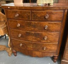 Victorian mahogany bow front chest of two short and three long cock beaded drawers standing on