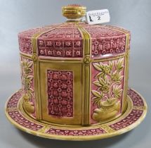 Victorian Wedgwood Majolica cheese dome and cover on a mustard and pink ground decorated with relief