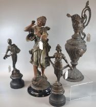 Pair of early 20th century spelter figurines on ebonised socle bases together with another