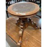 Victorian adjustable tripod walnut piano stool with probably later cane seat. (B.P. 21% + VAT)