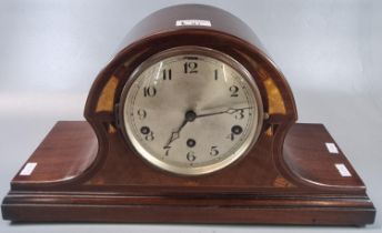 Edwardian inlaid mahogany hat shaped three train mantle clock. 25cm high approx. (B.P. 21% + VAT)
