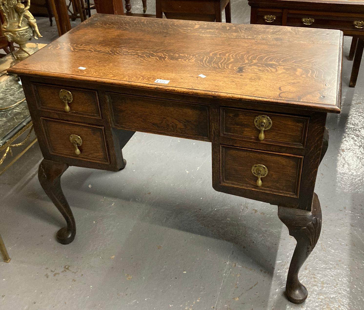 18th century style oak lowboy, the moulded top above a bank of five drawers raised and standing on