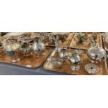 Two trays of silver plated items to include: teapot, ice bucket with tongs, egg cruet set, sauce