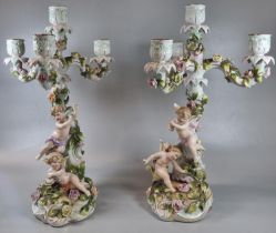 Pair of early 20th century Von Schierholz table candelabra depicting cherubs amongst encrusted