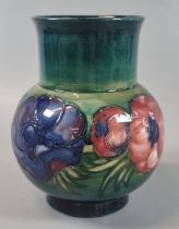 Moorcroft Pottery tube-lined vase, of globular form in the Anemone pattern. 13.5cm high approx.