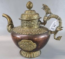 Large Tibetan brass overlay on copper 'butter-teapot' with a Makara spout and dragon handle. 27cm