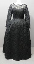 Lace full length black vintage 40's dress with long sleeves and sewn in petticoats. Includes
