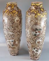 Pair of tall and slender Japanese earthenware Moriage vases, decorated with roundels of dragons