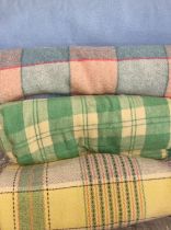 Box of vintage woollen blankets to include: three check blankets in various colourways and a blue '