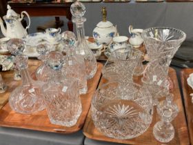 Two trays of assorted cut glass items to include: square section and other decanters with