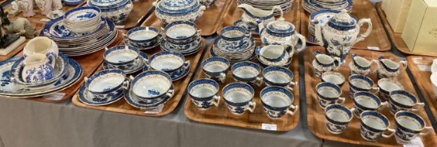 Eight trays of mainly Booths 'Real Old Willow' blue and white design tea and dinner ware items. (