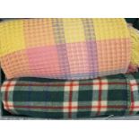 Box containing two vintage woollen blankets; one dark green ground check and one honeycomb multi-