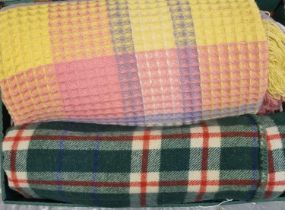 Box containing two vintage woollen blankets; one dark green ground check and one honeycomb multi-