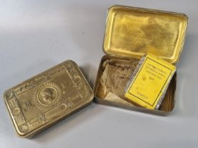 Pair of WWI Christmas 1914 brass boxes, one with the original tobacco packet. (2) (B.P. 21% + VAT)