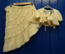 Vintage woollen crochet baby's blanket and woollen crochet baby's top, two hats and a pair of