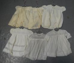 Collection of cotton and silk babies and children's clothing to include: embroidered dresses with