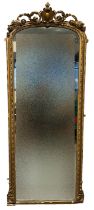 19th Century gilt gesso framed arched pier glass having shield and scroll work cresting above arched