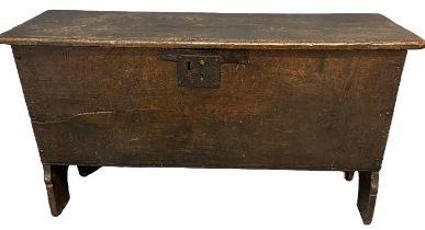17th Century oak plank chest with hinged lid above plain sides with end supports, candle drawer to
