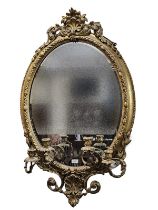 19th Century gilt gesso framed oval Girandole mirror with shell and scroll work pediment above egg