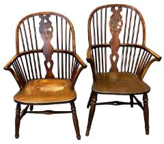 Pair of 19th Century yew wood and elm Windsor wheel and slat back elbow chairs, having solid seats