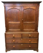19th Century Welsh oak two stage press cupboard, having moulded cornice over seaweed inlaid