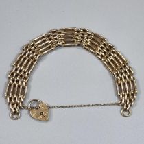 9ct gold five bar gate bracelet with heart shaped padlock. 20g approx. (B.P. 21% + VAT)