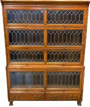 Early 20th century oak Globe Wernicke style lead glazed four tier bookcase with moulded cornice over