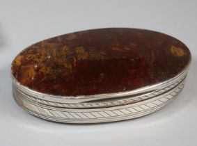 Late 18th/early 19th century moss agate and white metal snuff box, of oval form. 8x4.5cm approx. (