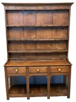 19th Century Welsh oak pot board dresser, having three shelf boarded rack back under a moulded