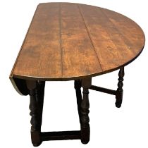 Large 17th Century style oval quadruple gate drop leaf dining table, to comfortably seat eight,