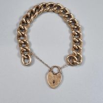 Victorian 9ct curb link engraved bracelet with heart shaped padlock. 22g approx. (B.P. 21% + VAT)