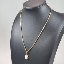 9ct gold chain or necklace with opal cabochon stone pendant in gold mount. 38cm long, 8.6g