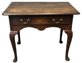 18th Century oak lowboy with moulded edged planked top, over a frieze drawer with shaped apron