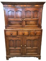 18th Century Welsh oak press cupboard having moulded dental cornice over geometrically inlaid