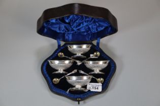 Cased set of four late Victorian silver boat shaped salts with spoons, by Charles Boyton II, London,