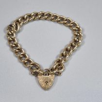 9ct gold curb link bracelet with heart shaped padlock. 35.2g approx. (B.P. 21% + VAT)