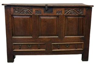 18th Century oak coffer, the moulded and iron hinged top with fitted candle box above an iron lock