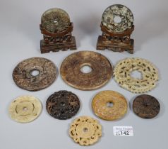 Collection of ten Chinese carved hardstone 'Bi' discs of varying designs including; repeating