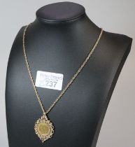 Late Victorian gold half sovereign dated 1900 inset in an ornate 9ct gold pendant mount on a 9ct